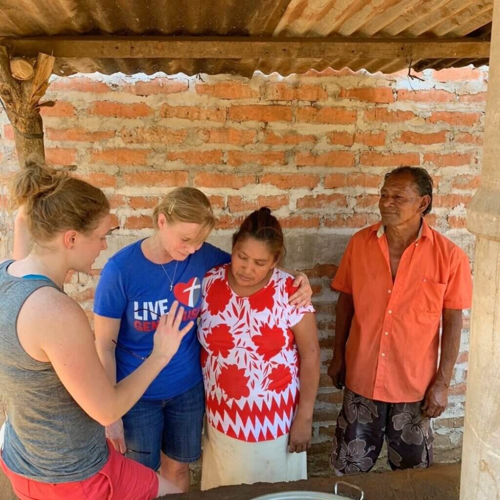 women praying for a woman